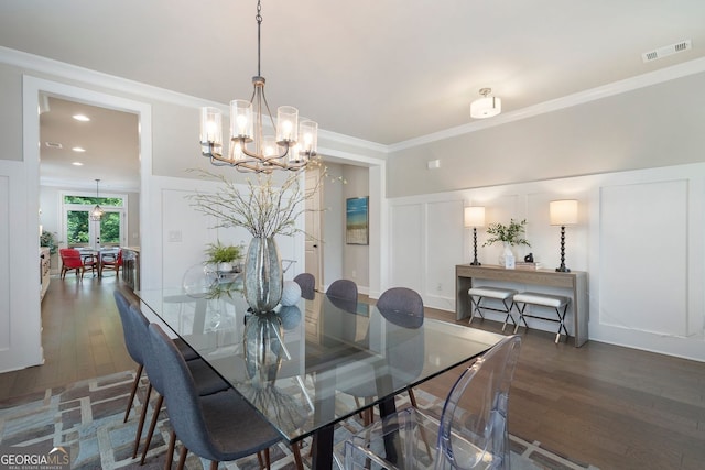 510 Walden Glen Ln, Alpharetta, GA 30004 - dining room with hardwood / wood-style flooring, a chandelier, a decorative wall, and ornamental molding