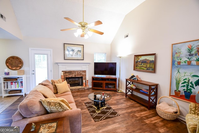 17 Kingsbrook Ln, Newnan, GA 30265 - living room with a ceiling fan, plenty of natural light, a fireplace, wood finished floors, and high vaulted ceiling