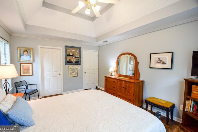 17 Kingsbrook Ln, Newnan, GA 30265 - bedroom featuring a tray ceiling, dark wood-style floors, ceiling fan, and crown molding