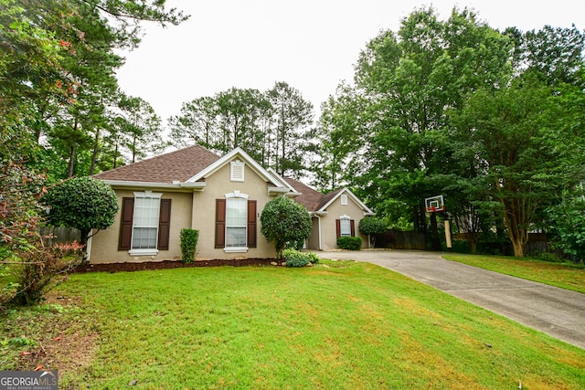 17 Kingsbrook Ln, Newnan, GA 30265 - view of front of property featuring driveway, stucco siding, and roof with shingles