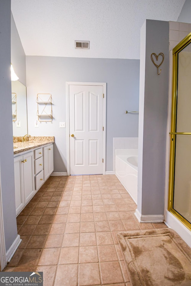 17 Kingsbrook Ln, Newnan, GA 30265 - full bath with vanity, a stall shower, a bath, and tile patterned flooring