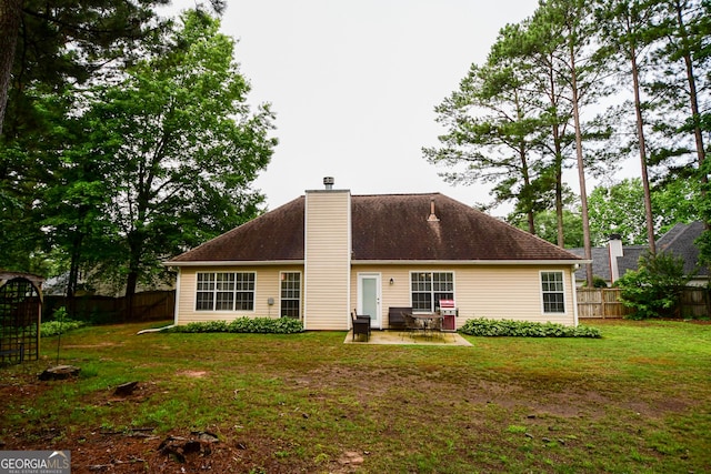 17 Kingsbrook Ln, Newnan, GA 30265 - rear view of property with a fenced backyard, a patio, and a chimney