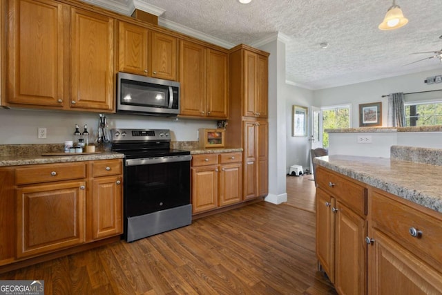 1641 Garland Mountain Trl, Waleska, GA 30183 - kitchen with stainless steel appliances, ornamental molding, brown cabinetry, dark wood-style flooring, and a textured ceiling