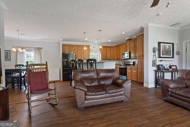 1641 Garland Mountain Trl, Waleska, GA 30183 - living area with a textured ceiling, dark wood-style flooring, a chandelier, crown molding, and ceiling fan