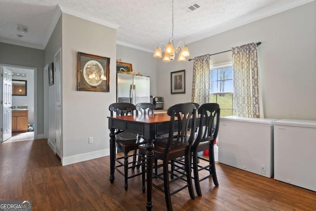 1641 Garland Mountain Trl, Waleska, GA 30183 - dining space with a textured ceiling, wood finished floors, a chandelier, and crown molding