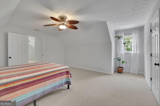 2095 Honeysuckle Dr, Cumming, GA 30040 - bedroom with carpet flooring, a textured ceiling, ceiling fan, and vaulted ceiling