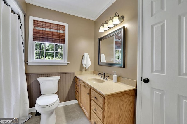 2095 Honeysuckle Dr, Cumming, GA 30040 - bathroom with ornamental molding, vanity, a wainscoted wall, and tile patterned floors