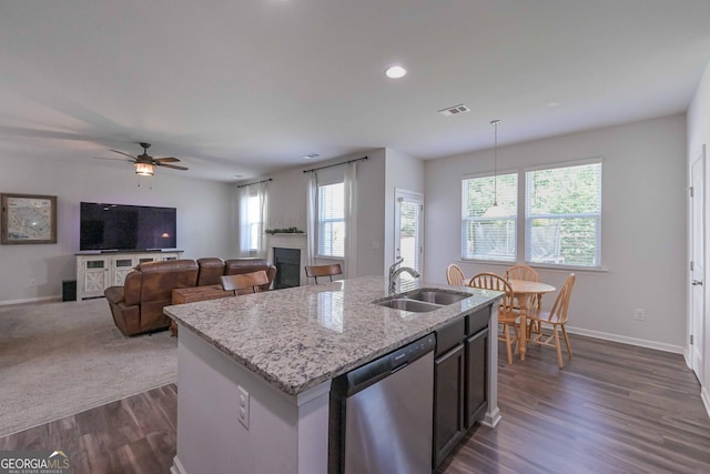 110 Serendipity Way, Dallas, GA 30157 - kitchen with stainless steel dishwasher, dark wood-type flooring, light stone countertops, plenty of natural light, and recessed lighting