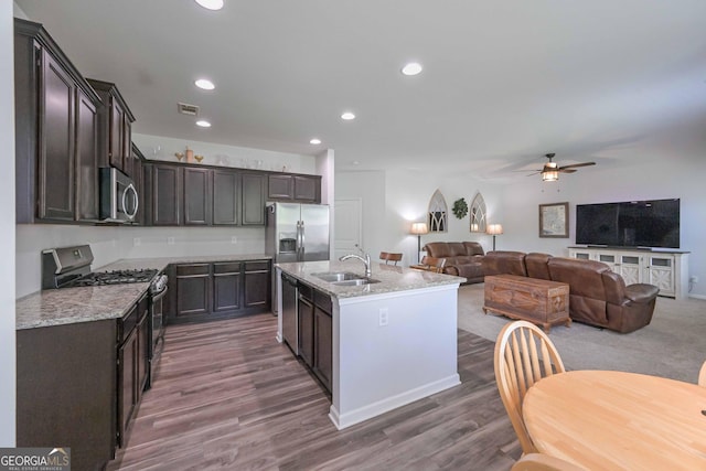 110 Serendipity Way, Dallas, GA 30157 - kitchen with appliances with stainless steel finishes, dark brown cabinetry, a ceiling fan, recessed lighting, and dark wood-style flooring