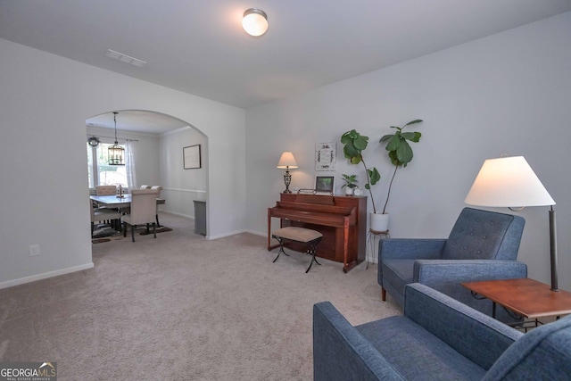 110 Serendipity Way, Dallas, GA 30157 - sitting room with arched walkways and carpet flooring
