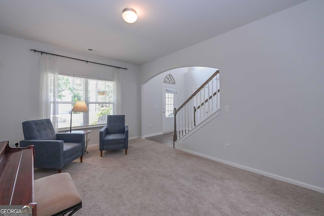 110 Serendipity Way, Dallas, GA 30157 - sitting room with arched walkways, carpet floors, and stairs