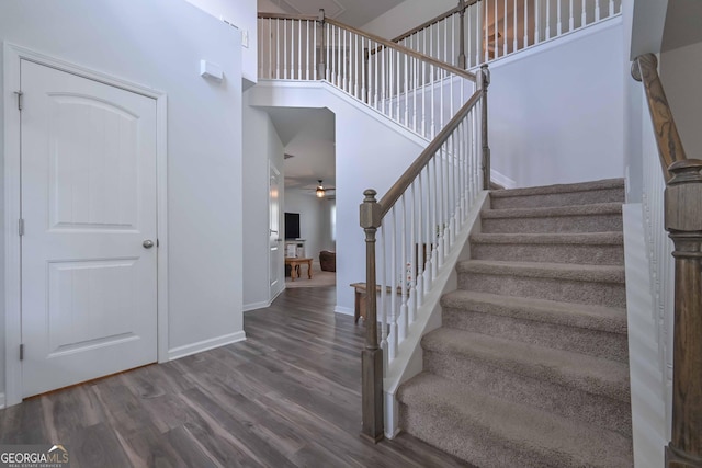 110 Serendipity Way, Dallas, GA 30157 - stairs featuring wood finished floors, a ceiling fan, and a high ceiling