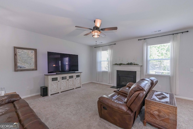 110 Serendipity Way, Dallas, GA 30157 - living area with carpet, ceiling fan, healthy amount of natural light, and a fireplace with flush hearth
