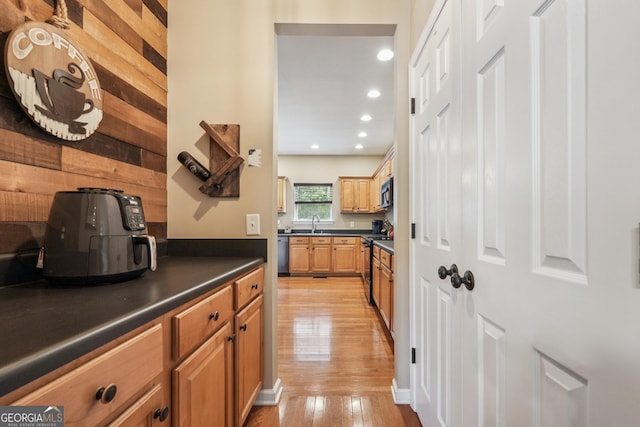 6521 Boulder Crest Ct, Flowery Branch, GA 30542 - kitchen with dark countertops, light wood-style floors, stainless steel appliances, and recessed lighting