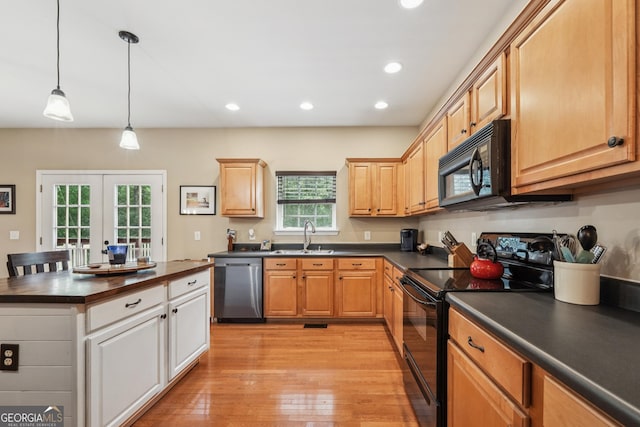 6521 Boulder Crest Ct, Flowery Branch, GA 30542 - kitchen with black appliances, dark countertops, light wood finished floors, recessed lighting, and hanging light fixtures