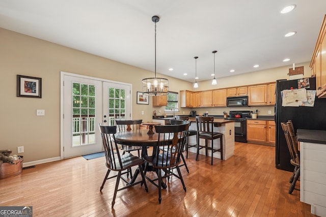 6521 Boulder Crest Ct, Flowery Branch, GA 30542 - dining room with light wood-style flooring, a chandelier, recessed lighting, and french doors