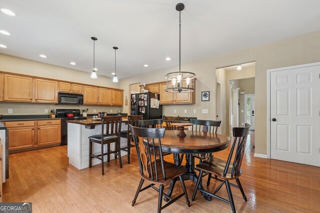 6521 Boulder Crest Ct, Flowery Branch, GA 30542 - dining area with light wood finished floors, a chandelier, and recessed lighting