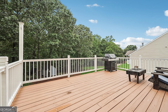6521 Boulder Crest Ct, Flowery Branch, GA 30542 - wooden deck featuring a grill