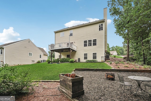 6521 Boulder Crest Ct, Flowery Branch, GA 30542 - back of property featuring a chimney, a lawn, and an outdoor fire pit