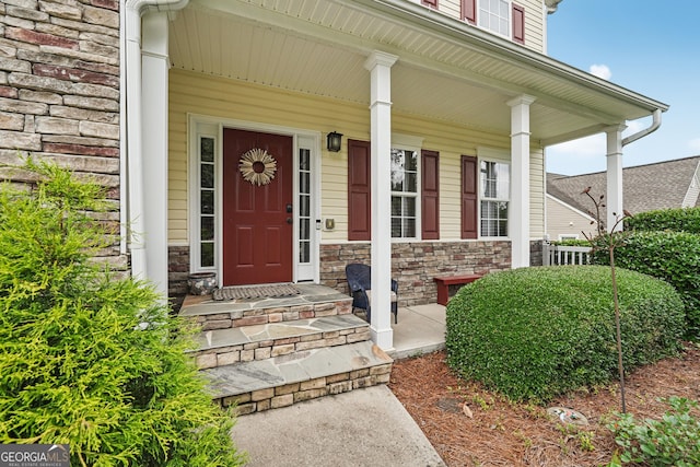 6521 Boulder Crest Ct, Flowery Branch, GA 30542 - entrance to property with covered porch and stone siding