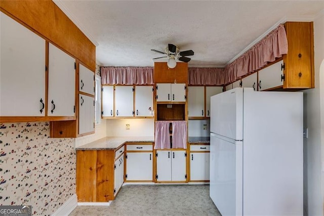 303 Hardee St, Dallas, GA 30132 - kitchen with freestanding refrigerator, a ceiling fan, and a textured ceiling