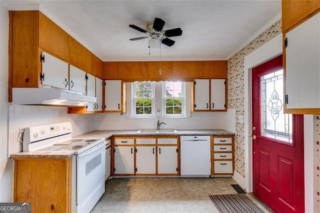 303 Hardee St, Dallas, GA 30132 - kitchen featuring white appliances, under cabinet range hood, crown molding, light countertops, and decorative backsplash