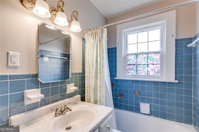 303 Hardee St, Dallas, GA 30132 - full bath with tile walls, vanity, shower / bathtub combination with curtain, and a wainscoted wall