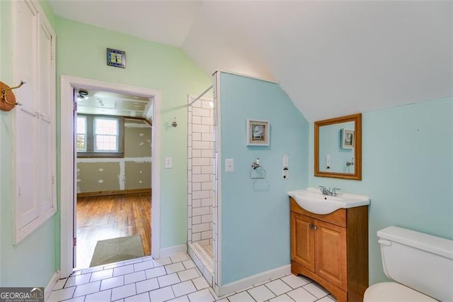 303 Hardee St, Dallas, GA 30132 - full bath featuring vaulted ceiling, vanity, and a tile shower
