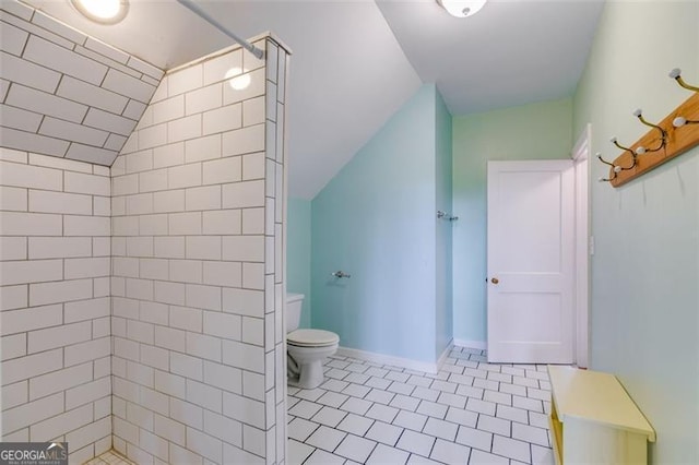 303 Hardee St, Dallas, GA 30132 - bathroom featuring vaulted ceiling and tiled shower