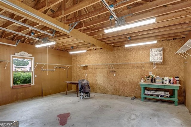303 Hardee St, Dallas, GA 30132 - miscellaneous room with a garage and unfinished concrete floors