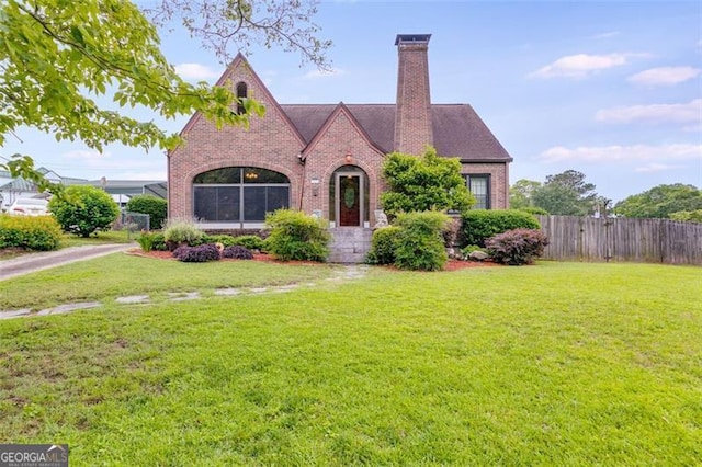 303 Hardee St, Dallas, GA 30132 - view of front of house featuring brick siding and a chimney