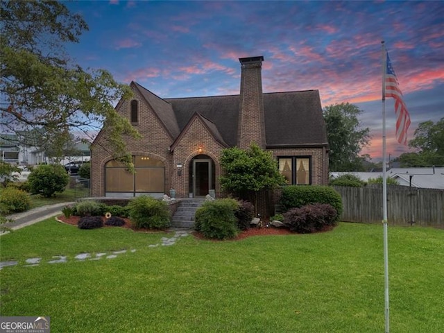303 Hardee St, Dallas, GA 30132 - view of front of house featuring brick siding, a chimney, and a garage
