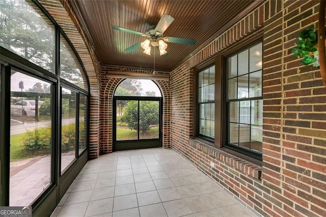 303 Hardee St, Dallas, GA 30132 - unfurnished sunroom featuring brick wall, ceiling fan, tile patterned flooring, and wooden ceiling