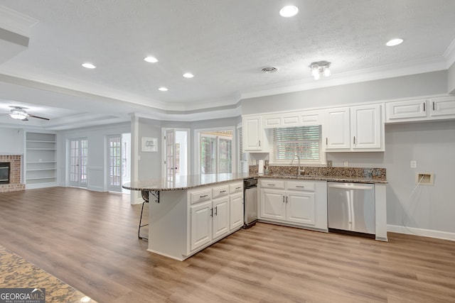 40 Springwater Chase, Newnan, GA 30265 - kitchen with dishwasher, a peninsula, white cabinets, open floor plan, and recessed lighting