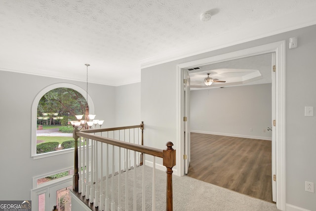 40 Springwater Chase, Newnan, GA 30265 - corridor featuring a chandelier, an upstairs landing, wood finished floors, and a textured ceiling
