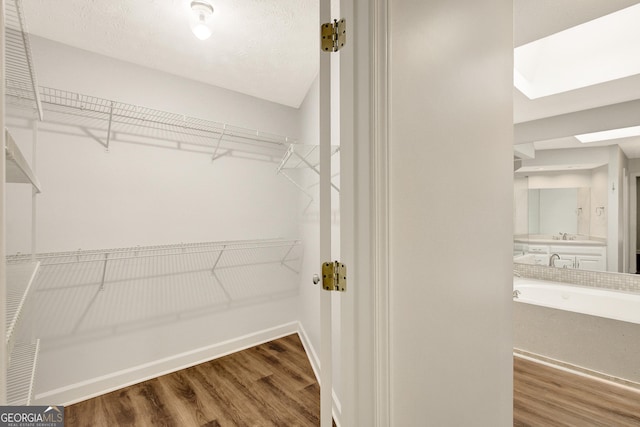 40 Springwater Chase, Newnan, GA 30265 - walk in closet featuring wood finished floors