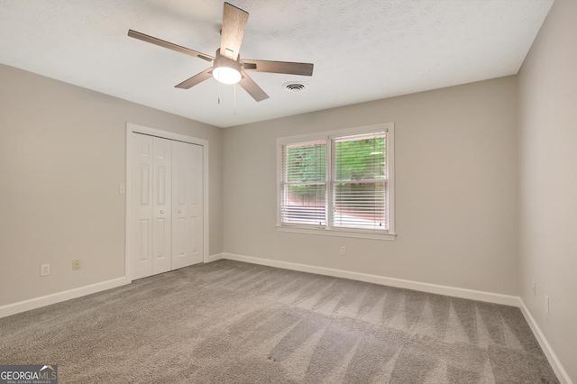 40 Springwater Chase, Newnan, GA 30265 - unfurnished bedroom featuring a closet, carpet floors, and ceiling fan