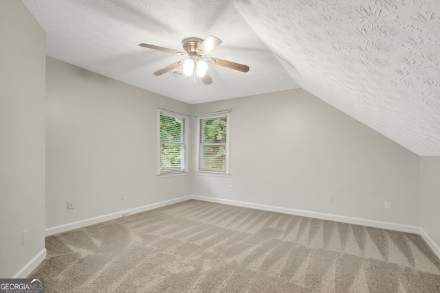 40 Springwater Chase, Newnan, GA 30265 - bonus room with a textured ceiling, lofted ceiling, light colored carpet, and ceiling fan