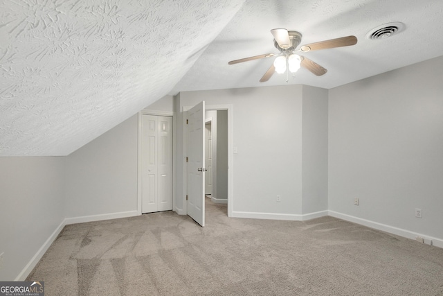 40 Springwater Chase, Newnan, GA 30265 - bonus room with a textured ceiling, carpet, lofted ceiling, and a ceiling fan