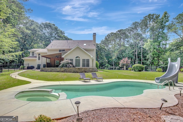 40 Springwater Chase, Newnan, GA 30265 - view of swimming pool with a water slide, a patio area, view of scattered trees, and a pool with connected hot tub