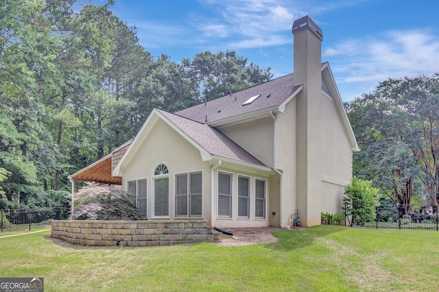 40 Springwater Chase, Newnan, GA 30265 - back of property with stucco siding, a chimney, and a shingled roof