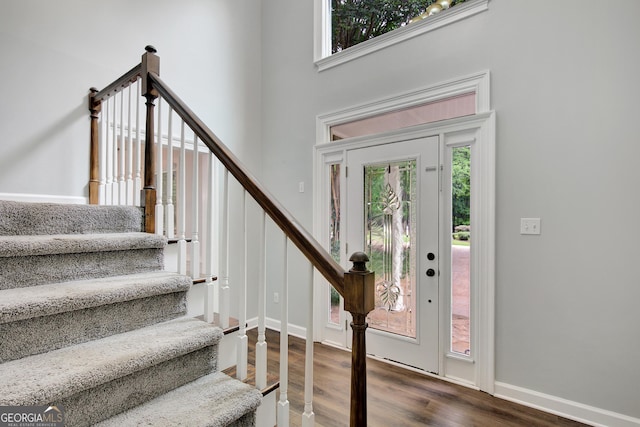 40 Springwater Chase, Newnan, GA 30265 - entryway with dark wood-style floors, stairway, and a high ceiling
