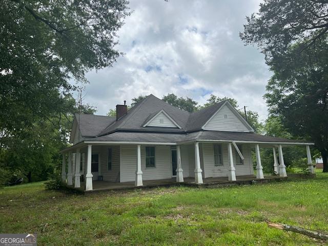 680 Thomas Rd, Trion, GA 30753 - farmhouse inspired home with covered porch, a chimney, and a front yard