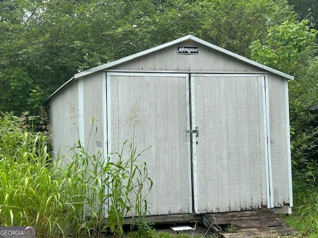 680 Thomas Rd, Trion, GA 30753 - view of shed featuring a wooded view
