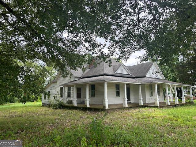 680 Thomas Rd, Trion, GA 30753 - view of property exterior featuring covered porch and a lawn