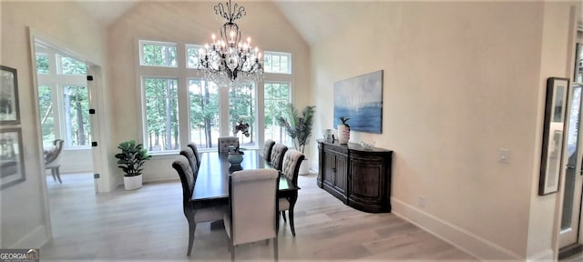 1330 Jackson Ridge Rd, Greensboro, GA 30642 - dining space with light wood-type flooring, plenty of natural light, a chandelier, and lofted ceiling