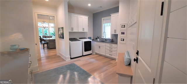 1330 Jackson Ridge Rd, Greensboro, GA 30642 - kitchen with independent washer and dryer, light wood-style floors, healthy amount of natural light, white cabinetry, and recessed lighting