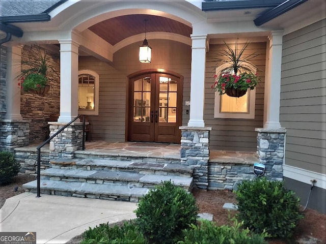 1330 Jackson Ridge Rd, Greensboro, GA 30642 - property entrance with covered porch, french doors, and stone siding