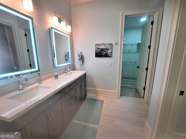 1330 Jackson Ridge Rd, Greensboro, GA 30642 - bathroom featuring double vanity and a walk in closet