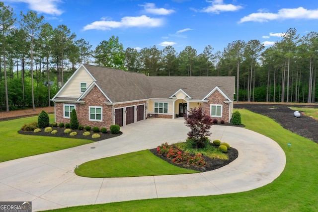 1413 N Walkers Mill Rd, Griffin, GA 30223 - view of front facade featuring curved driveway, an attached garage, brick siding, and a front lawn